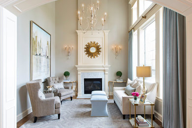 Design ideas for a traditional formal enclosed living room in San Francisco with beige walls, medium hardwood floors, a standard fireplace and a stone fireplace surround.