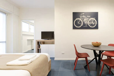 Esempio di un piccolo soggiorno contemporaneo stile loft con pavimento in gres porcellanato