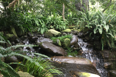 Design ideas for a large mediterranean shade backyard waterfall in Santa Barbara.