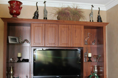 Example of a mid-sized classic open concept beige floor and ceramic tile living room design in Other with no fireplace, a media wall and beige walls