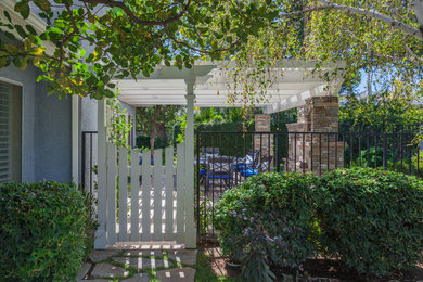Design ideas for a large traditional partial sun side yard stone landscaping in Los Angeles.