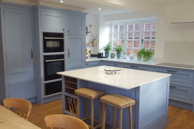 Inspiration for a transitional kitchen in Surrey.