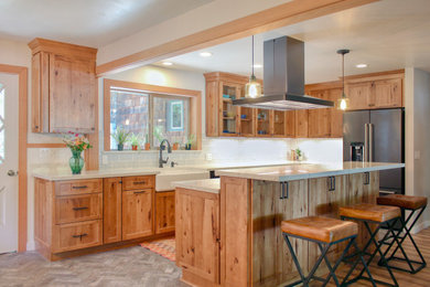 Example of a mid-sized mountain style l-shaped brick floor and gray floor open concept kitchen design in Other with an undermount sink, shaker cabinets, medium tone wood cabinets, quartz countertops, blue backsplash, ceramic backsplash, stainless steel appliances, an island and white countertops