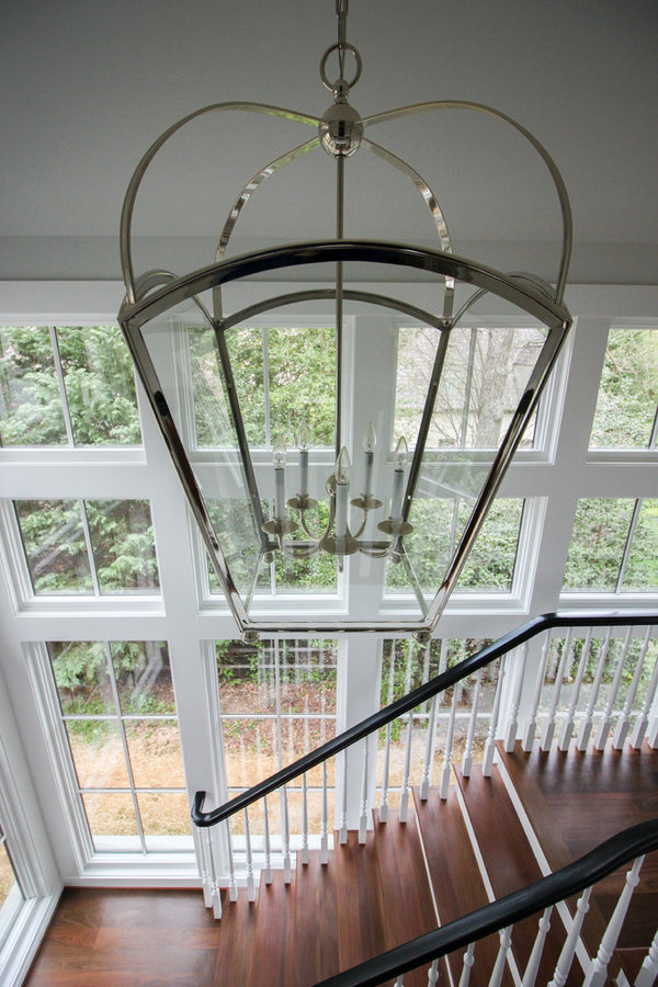 Powerful Impression by Floating Staircase in Suburban Foyer