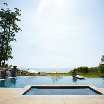Modern pool, spa and landscape on lakeshore