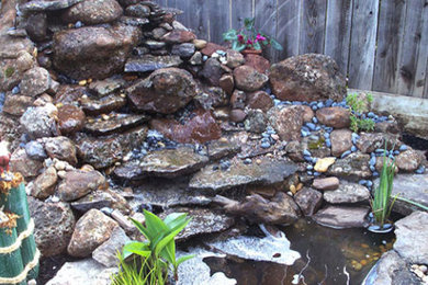 Photo of a traditional backyard stone landscaping in Sacramento.