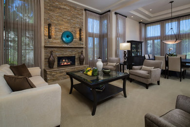 Design ideas for a large contemporary formal open concept living room in Orange County with beige walls, carpet, a standard fireplace, a stone fireplace surround and no tv.