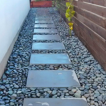 River Rocks with Concrete Paver Walkway