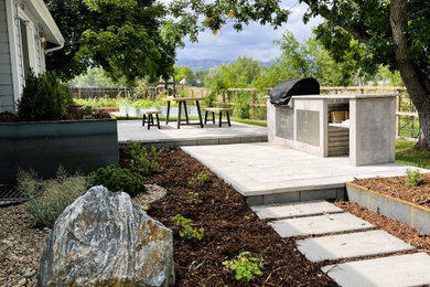 Patio kitchen - mid-sized transitional backyard concrete paver patio kitchen idea in Denver
