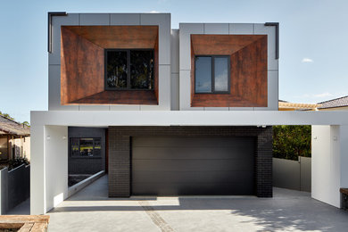 Large contemporary two-storey brick black house exterior in Sydney with a flat roof.