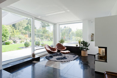 Design ideas for a contemporary family room in Cologne.