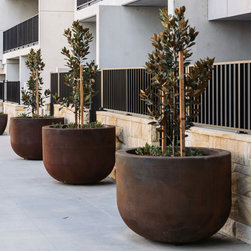 GRC Giant U Bowls manufactured in a Rust finish - Outdoor Pots And Planters