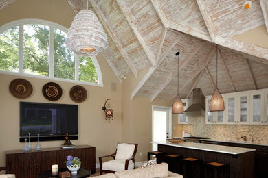 Family room - contemporary open concept family room idea in New York with beige walls and a wall-mounted tv