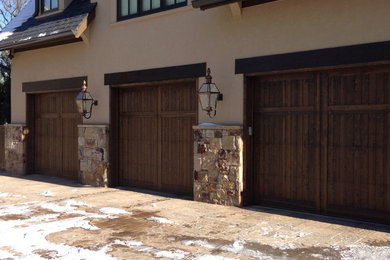 Inspiration for a large rustic attached three-car garage remodel in DC Metro