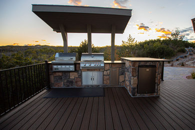 Inspiration for a large timeless backyard ground level outdoor kitchen deck remodel in Denver
