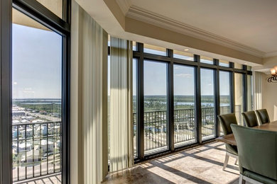 Inspiration for a large transitional open concept ceramic tile and beige floor living room remodel in Miami with beige walls and no fireplace