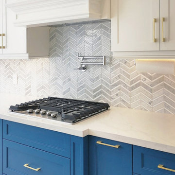 White shaker style upper cabinets contrasted with Zima Blue lower custom cabinet