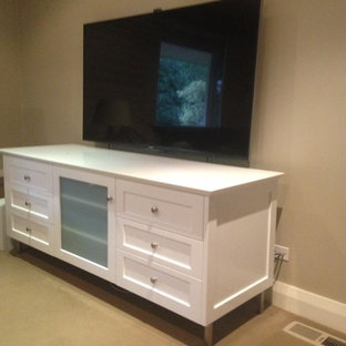 Home theater - mid-sized modern carpeted home theater idea in Newcastle - Maitland with beige walls and a wall-mounted tv