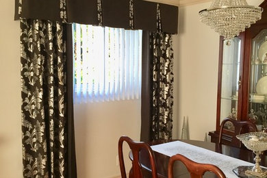 Trendy brown floor dining room photo in Toronto with beige walls