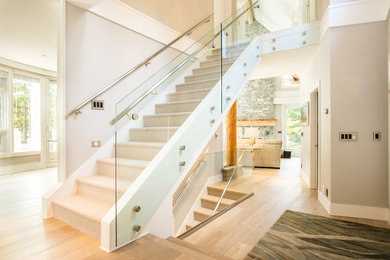 Inspiration for a mid-sized contemporary carpeted straight metal railing staircase remodel in Other with carpeted risers