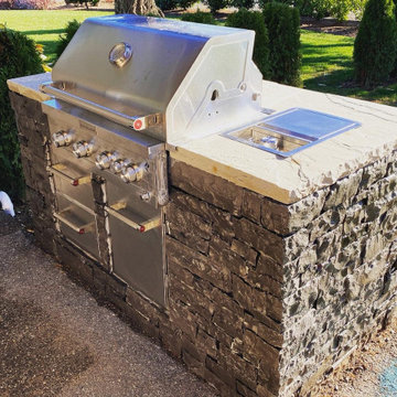 Outdoor kitchen and pass through gas fireplace