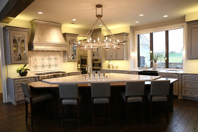 Eat-in kitchen - huge eclectic l-shaped eat-in kitchen idea in Kansas City with copper countertops, metallic backsplash and an island