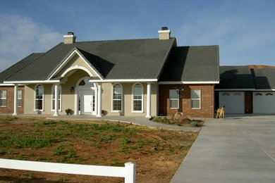 Beige two-story brick exterior home photo in Las Vegas