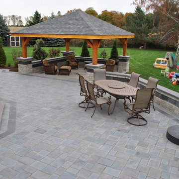 A Backyard Patio With a Spacious Feel and an Amazing Fireplace!