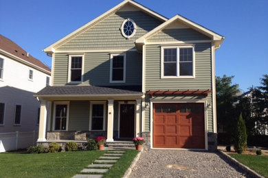 Inspiration for a mid-sized craftsman green two-story wood exterior home remodel in New York