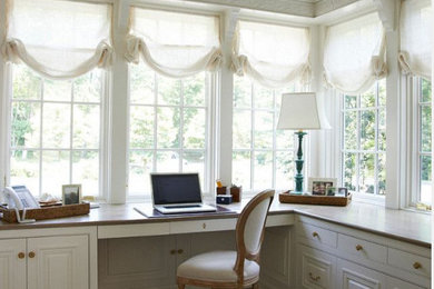 This is an example of a classic home office in London with a built-in desk.
