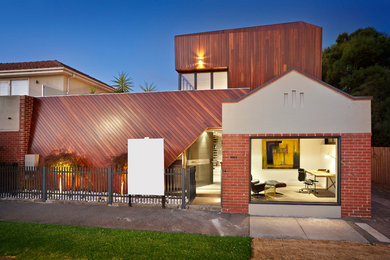 Design ideas for a contemporary exterior in Melbourne with wood siding.