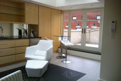 Example of a mid-sized formal and loft-style living room design in New York with beige walls