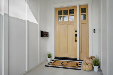 Inspiration for a medium sized rural front door in San Francisco with white walls, a single front door and a light wood front door.