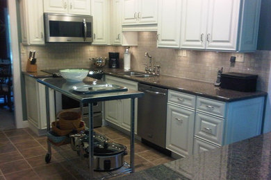 Example of a classic kitchen design in Other