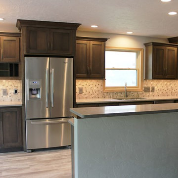 Bettendorf, IA- Gorgeous Galley Kitchen Remodel With Gray Stain and Quartz Tops