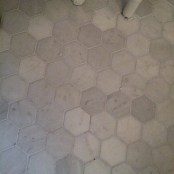 Marble Look Shower Stall with Black and White Mosaic Floor
