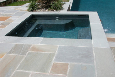 Pool house - traditional backyard rectangular pool house idea in New York