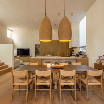 Open Dining Area with Custom Wood Lighting and Warm Finishes