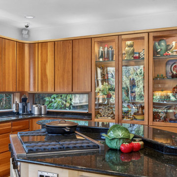 Luxury Mid-Century Kitchen with Custom Wood Cabinetry and Stone Countertops