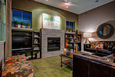 Inspiration for a transitional family room remodel in Denver with a tile fireplace