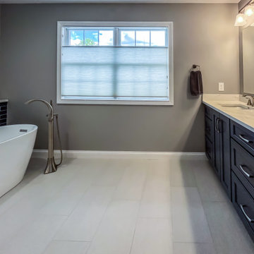 Primary Bathroom with Blue-Gray Vanity and Deep Blue Tiled Feature Wall