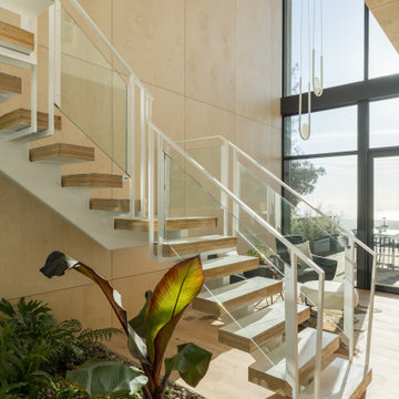 Double-height floating stair - Fold House Berkeley Hills new construction