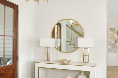 Entryway - small transitional light wood floor, beige floor and shiplap wall entryway idea in Charleston with white walls and a brown front door