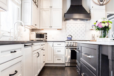 Inspiration for a large transitional dark wood floor and black floor eat-in kitchen remodel in Cleveland with an undermount sink, raised-panel cabinets, white cabinets, quartzite countertops, gray backsplash, marble backsplash, paneled appliances, an island and gray countertops