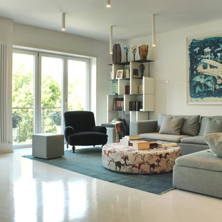 Immagine di un soggiorno minimalista con sala formale, pareti bianche e pavimento in gres porcellanato