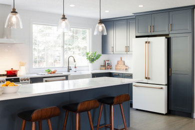 Example of a transitional kitchen design in Calgary