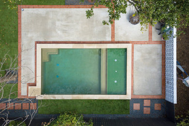 Small eclectic backyard pool photo in Austin