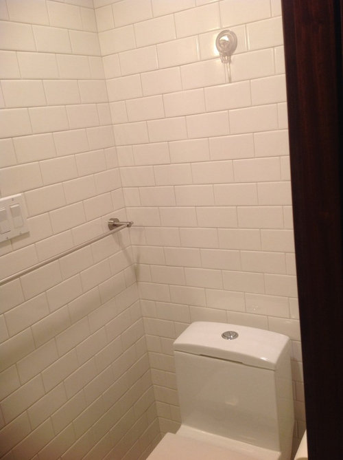 What art should I hang above toilet in Mid century modern bathroom?