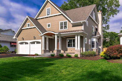 Example of a large transitional beige two-story wood exterior home design in Chicago with a shingle roof