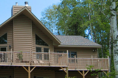 Mountain style beige two-story metal exterior home photo in Other